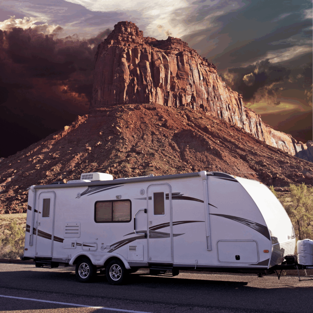 RV in front of a scenic mountain ridge