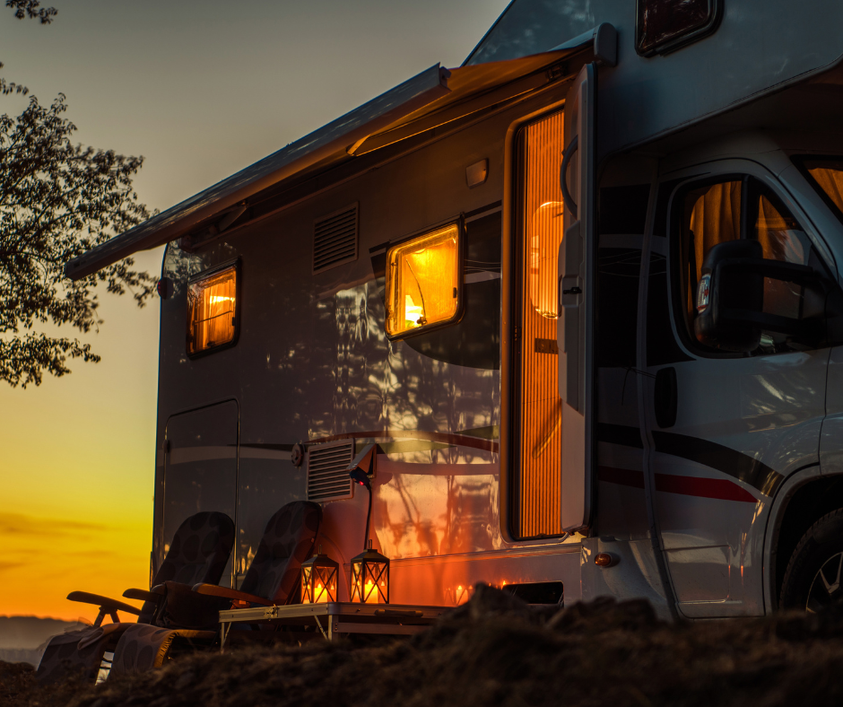 Night shot of lights on inside of a RV at sunset